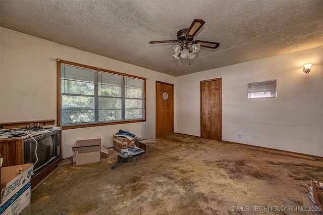 506 S 8th, Davis, OK 73030 - unfurnished living room featuring ceiling fan, a textured ceiling, and carpet flooring