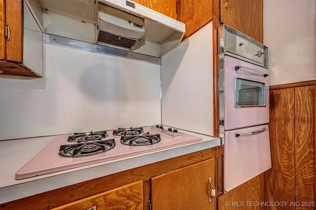 506 S 8th, Davis, OK 73030 - kitchen featuring a warming drawer and brown cabinetry
