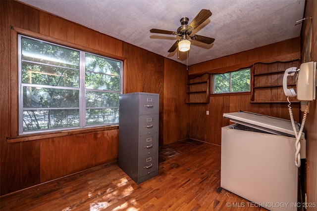 506 S 8th, Davis, OK 73030 - office area with wooden walls, ceiling fan, and wood finished floors