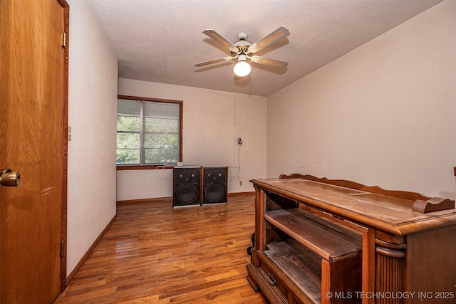 506 S 8th, Davis, OK 73030 - bedroom with wood finished floors, baseboards, and a textured ceiling