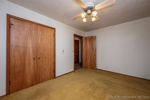 506 S 8th, Davis, OK 73030 - unfurnished bedroom featuring carpet floors, a closet, baseboards, and ceiling fan