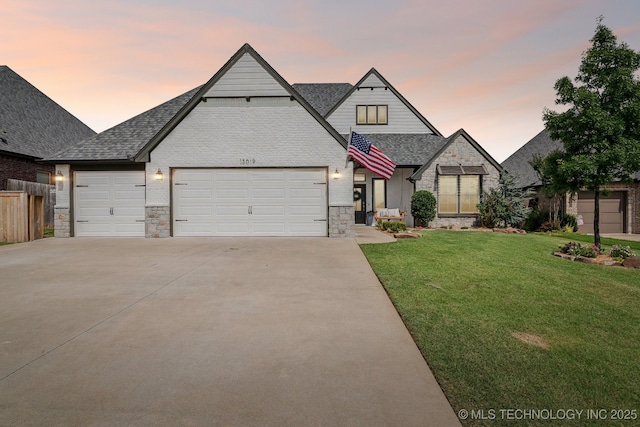 13019 S 5th Pl, Jenks, OK 74037 - view of front of home with driveway, stone siding, a garage, and a shingled roof
