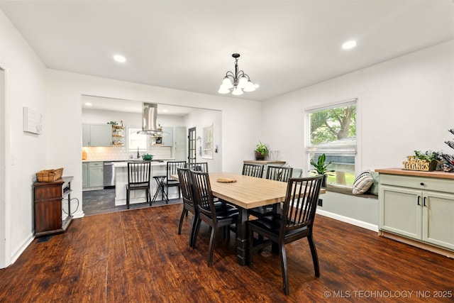 1206 S Osage Ave, Bartlesville, OK 74003 - dining room featuring a chandelier, dark wood-type flooring, recessed lighting, and baseboards
