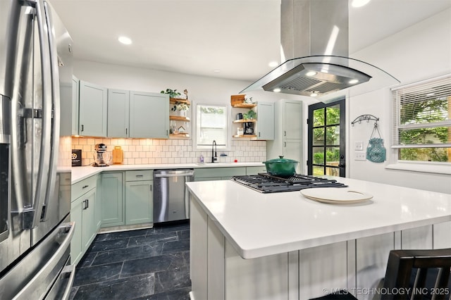 1206 S Osage Ave, Bartlesville, OK 74003 - kitchen with appliances with stainless steel finishes, island exhaust hood, a sink, open shelves, and light countertops