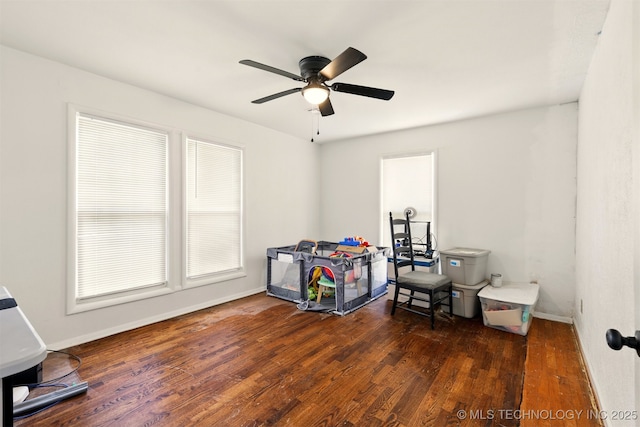 1206 S Osage Ave, Bartlesville, OK 74003 - rec room with wood finished floors, a ceiling fan, and baseboards