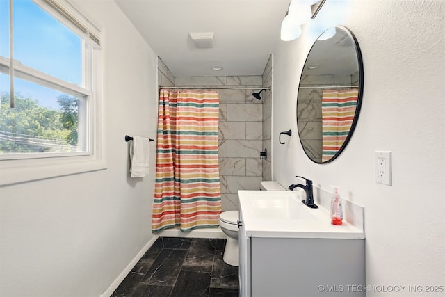 1206 S Osage Ave, Bartlesville, OK 74003 - full bath with vanity, toilet, curtained shower, and baseboards