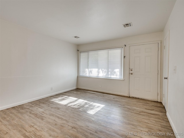 2409 N Urbana Ave, Tulsa, OK 74115 - foyer entrance featuring wood finished floors and baseboards
