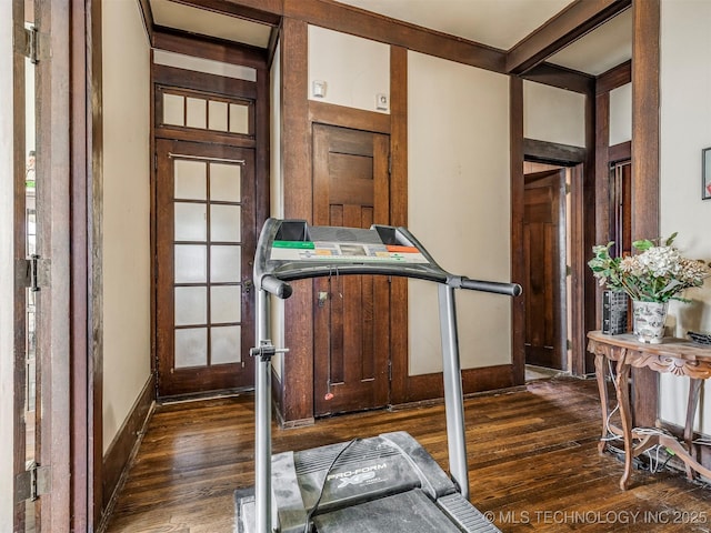 820 N Grand Ave, Okmulgee, OK 74447 - workout area with dark wood-style flooring and baseboards