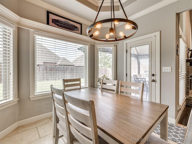 7605 E 82nd Pl, Owasso, OK 74055 - dining area with a chandelier, ornamental molding, plenty of natural light, and baseboards