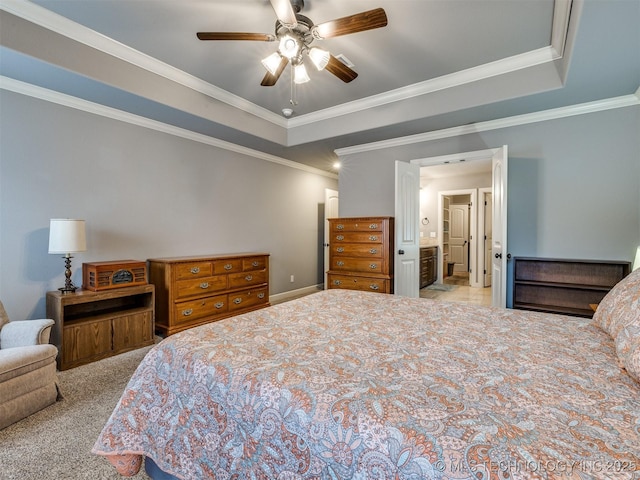 7605 E 82nd Pl, Owasso, OK 74055 - carpeted bedroom with a tray ceiling, ornamental molding, a ceiling fan, and connected bathroom