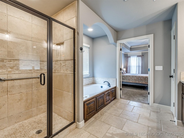 7605 E 82nd Pl, Owasso, OK 74055 - full bath with a garden tub, a stall shower, ensuite bath, and stone tile floors