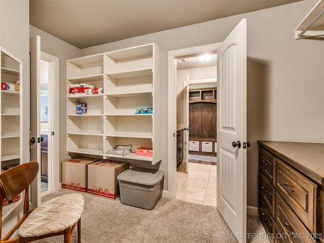 7605 E 82nd Pl, Owasso, OK 74055 - walk in closet featuring light colored carpet