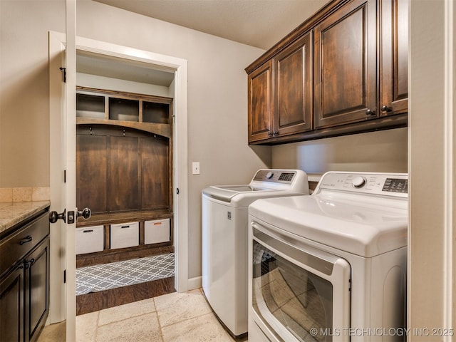 7605 E 82nd Pl, Owasso, OK 74055 - laundry area featuring cabinet space and washer and clothes dryer