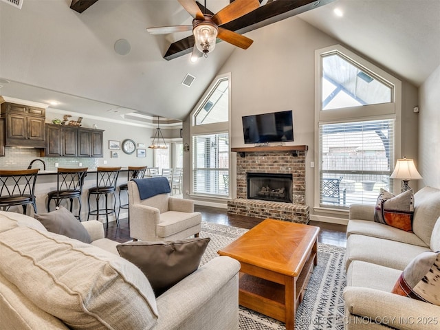 7605 E 82nd Pl, Owasso, OK 74055 - living room featuring high vaulted ceiling, wood finished floors, a ceiling fan, a fireplace, and recessed lighting