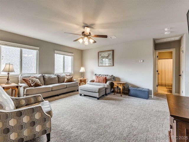 7605 E 82nd Pl, Owasso, OK 74055 - living area with carpet flooring and ceiling fan