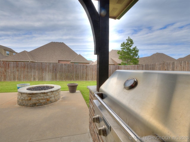 7605 E 82nd Pl, Owasso, OK 74055 - view of patio with a fire pit and area for grilling