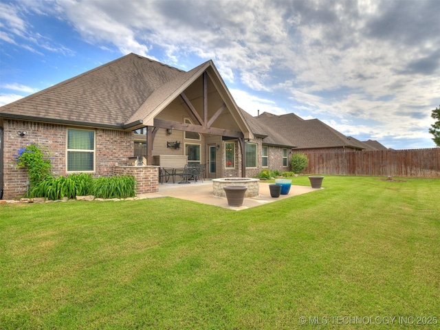 7605 E 82nd Pl, Owasso, OK 74055 - rear view of property with a patio area, roof with shingles, and brick siding