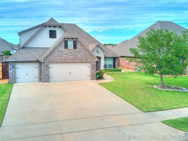 7605 E 82nd Pl, Owasso, OK 74055 - view of front of house with stucco siding, driveway, a front yard, brick siding, and roof with shingles