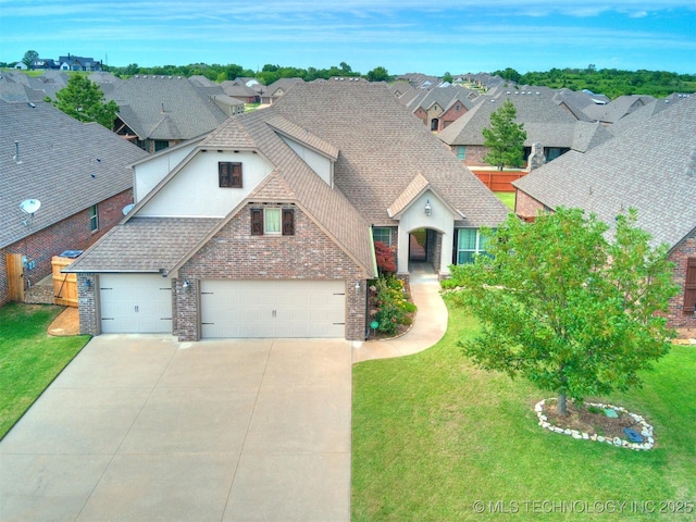 7605 E 82nd Pl, Owasso, OK 74055 - view of front of home featuring concrete driveway, stucco siding, an attached garage, brick siding, and a shingled roof