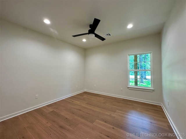 12443 Longboard Loop, Kingston, OK 73439 - unfurnished room with wood finished floors, baseboards, ceiling fan, and recessed lighting