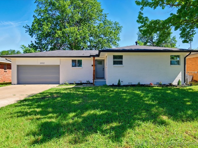 10931 E 4th Pl, Tulsa, OK 74128 - ranch-style home with an attached garage, brick siding, a front lawn, and driveway