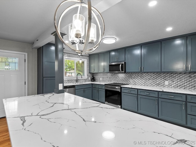 10931 E 4th Pl, Tulsa, OK 74128 - kitchen featuring appliances with stainless steel finishes, a sink, a chandelier, backsplash, and recessed lighting