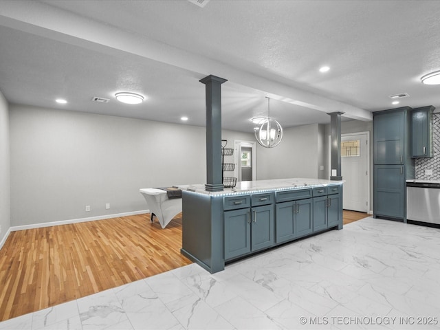 10931 E 4th Pl, Tulsa, OK 74128 - kitchen with dishwasher, decorative columns, light marble finish floors, baseboards, and a textured ceiling