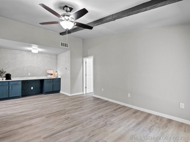 10931 E 4th Pl, Tulsa, OK 74128 - kitchen featuring light wood-type flooring, ceiling fan, blue cabinets, baseboards, and light countertops