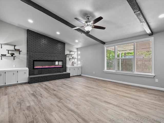 10931 E 4th Pl, Tulsa, OK 74128 - unfurnished living room featuring light wood-style floors, a ceiling fan, a brick fireplace, baseboards, and recessed lighting