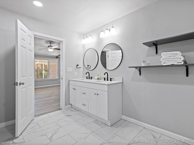 10931 E 4th Pl, Tulsa, OK 74128 - full bathroom featuring baseboards, marble look tile flooring, ceiling fan, double vanity, and recessed lighting