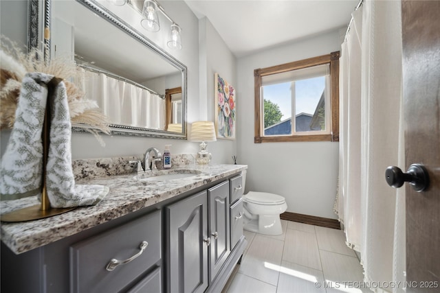 4341 E 56th Pl, Tulsa, OK 74135 - full bathroom with vanity, toilet, baseboards, and tile patterned flooring