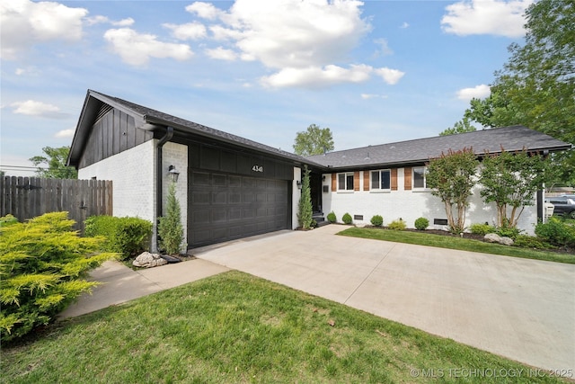 4341 E 56th Pl, Tulsa, OK 74135 - view of front of home featuring brick siding, concrete driveway, and an attached garage