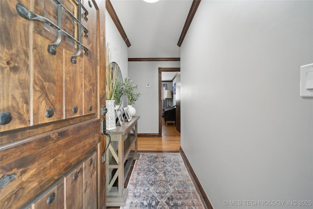 4341 E 56th Pl, Tulsa, OK 74135 - corridor with crown molding, baseboards, and wood finished floors