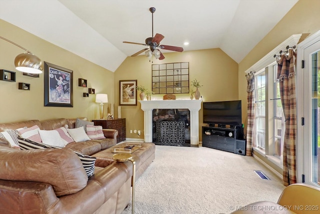5506 E 110th Pl, Tulsa, OK 74137 - carpeted living room featuring lofted ceiling, a ceiling fan, and a high end fireplace