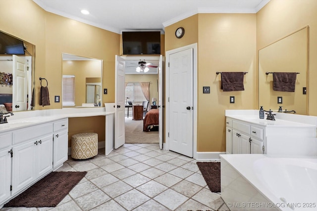 5506 E 110th Pl, Tulsa, OK 74137 - ensuite bathroom featuring two vanities, crown molding, a bath, a ceiling fan, and tile patterned flooring