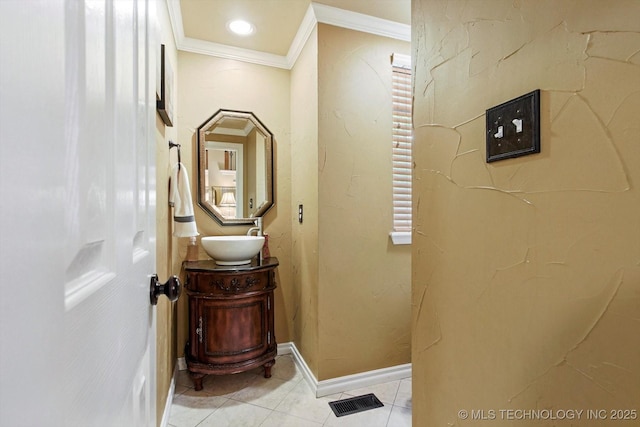 5506 E 110th Pl, Tulsa, OK 74137 - bathroom with crown molding, vanity, tile patterned floors, and baseboards