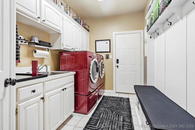 5506 E 110th Pl, Tulsa, OK 74137 - washroom with washing machine and dryer, light tile patterned floors, and cabinet space