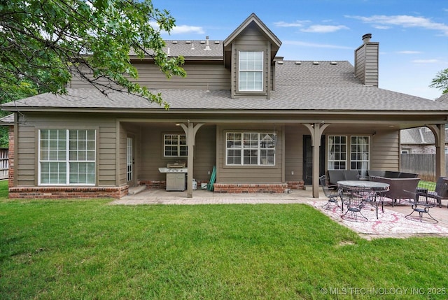 5506 E 110th Pl, Tulsa, OK 74137 - back of house with a patio, a chimney, roof with shingles, and brick siding