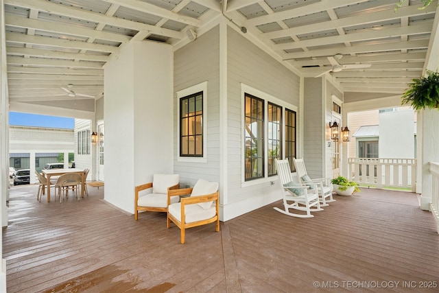52 Redbud St, Carlton Landing, OK 74432 - porch with ceiling fan and outdoor dining area