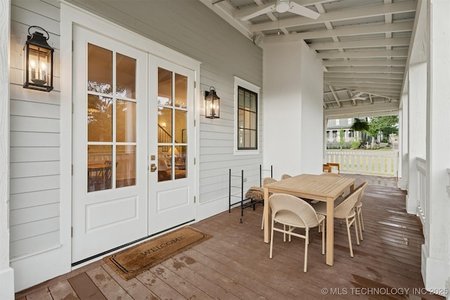 52 Redbud St, Carlton Landing, OK 74432 - wooden deck with french doors, ceiling fan, and outdoor dining area