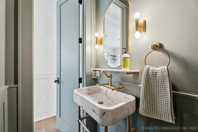 52 Redbud St, Carlton Landing, OK 74432 - bathroom featuring wood finished floors and a sink