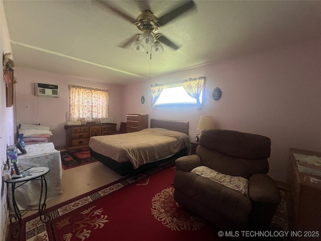 101 N 3rd St, Hartshorne, OK 74547 - bedroom with a wall mounted air conditioner and a ceiling fan