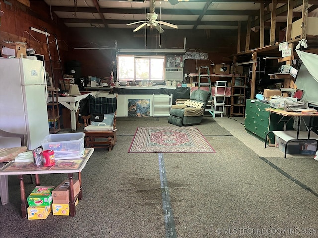 101 N 3rd St, Hartshorne, OK 74547 - garage featuring freestanding refrigerator and a ceiling fan