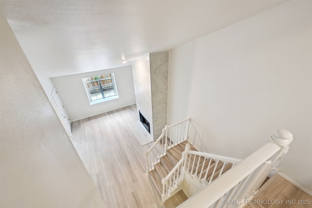 8935 S Norwood Ave Unit 1402, Tulsa, OK 74137 - stairs with wood finished floors and a fireplace