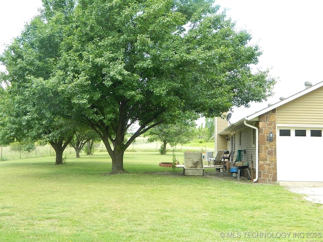 173 County Road 5305th Rd, Wynona, OK 74084 - view of grassy yard with an attached garage