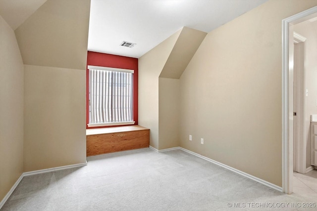 6007 E 76th Ct, Tulsa, OK 74136 - additional living space featuring vaulted ceiling, carpet flooring, and baseboards