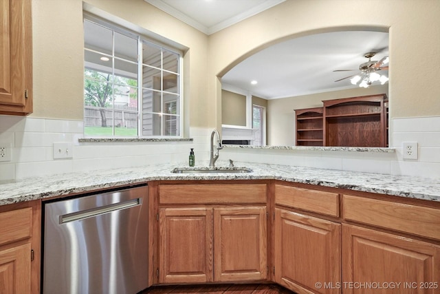 6007 E 76th Ct, Tulsa, OK 74136 - kitchen with stainless steel dishwasher, a sink, ornamental molding, plenty of natural light, and light stone countertops