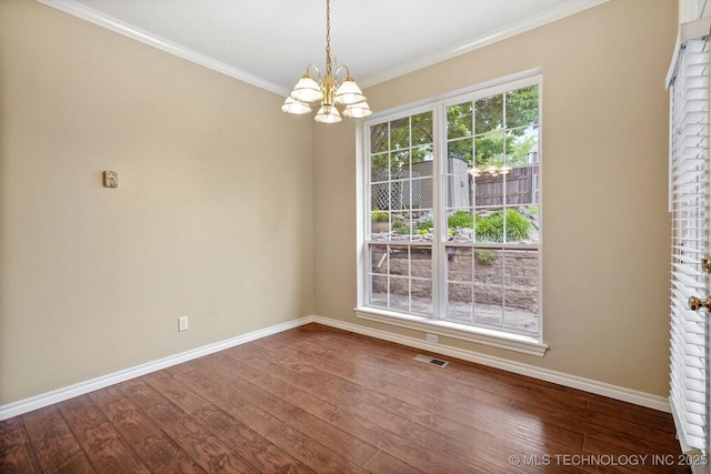 6007 E 76th Ct, Tulsa, OK 74136 - unfurnished dining area with a chandelier, baseboards, dark wood-style flooring, and crown molding