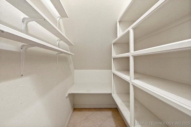 6007 E 76th Ct, Tulsa, OK 74136 - walk in closet with tile patterned flooring