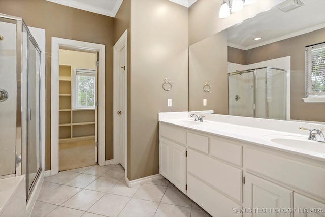 6007 E 76th Ct, Tulsa, OK 74136 - full bathroom with a stall shower, double vanity, crown molding, and plenty of natural light